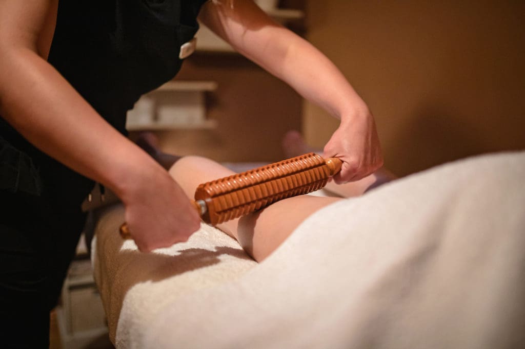 Massage therapist using a roller